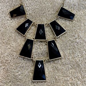 Black and gold colored necklace